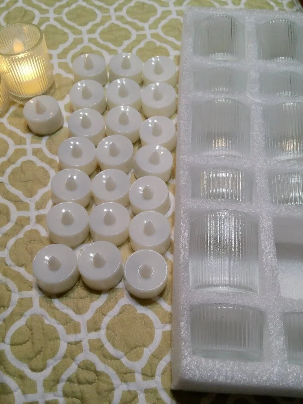 23 VOTIVES AND 23 CANDLES WITH BATTERY GREAT CONDITION
